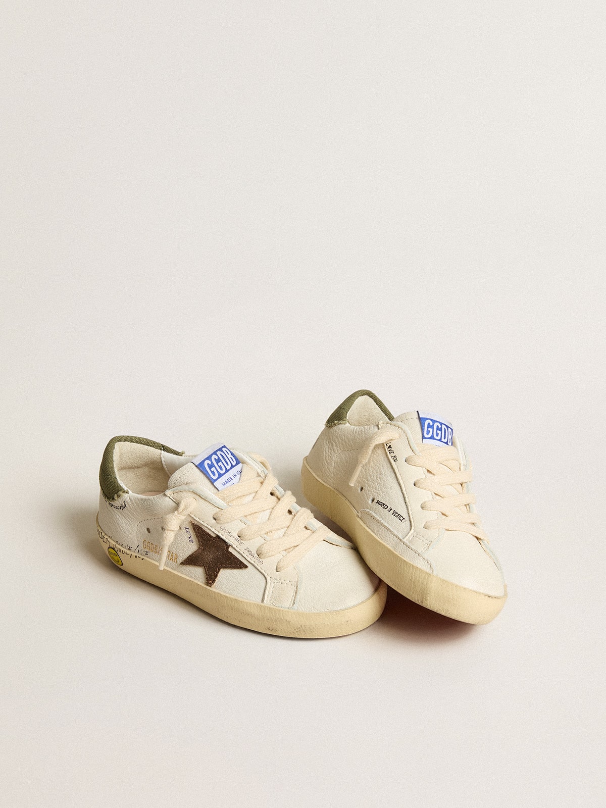 Super-Star Junior in nappa with suede star and green heel tab