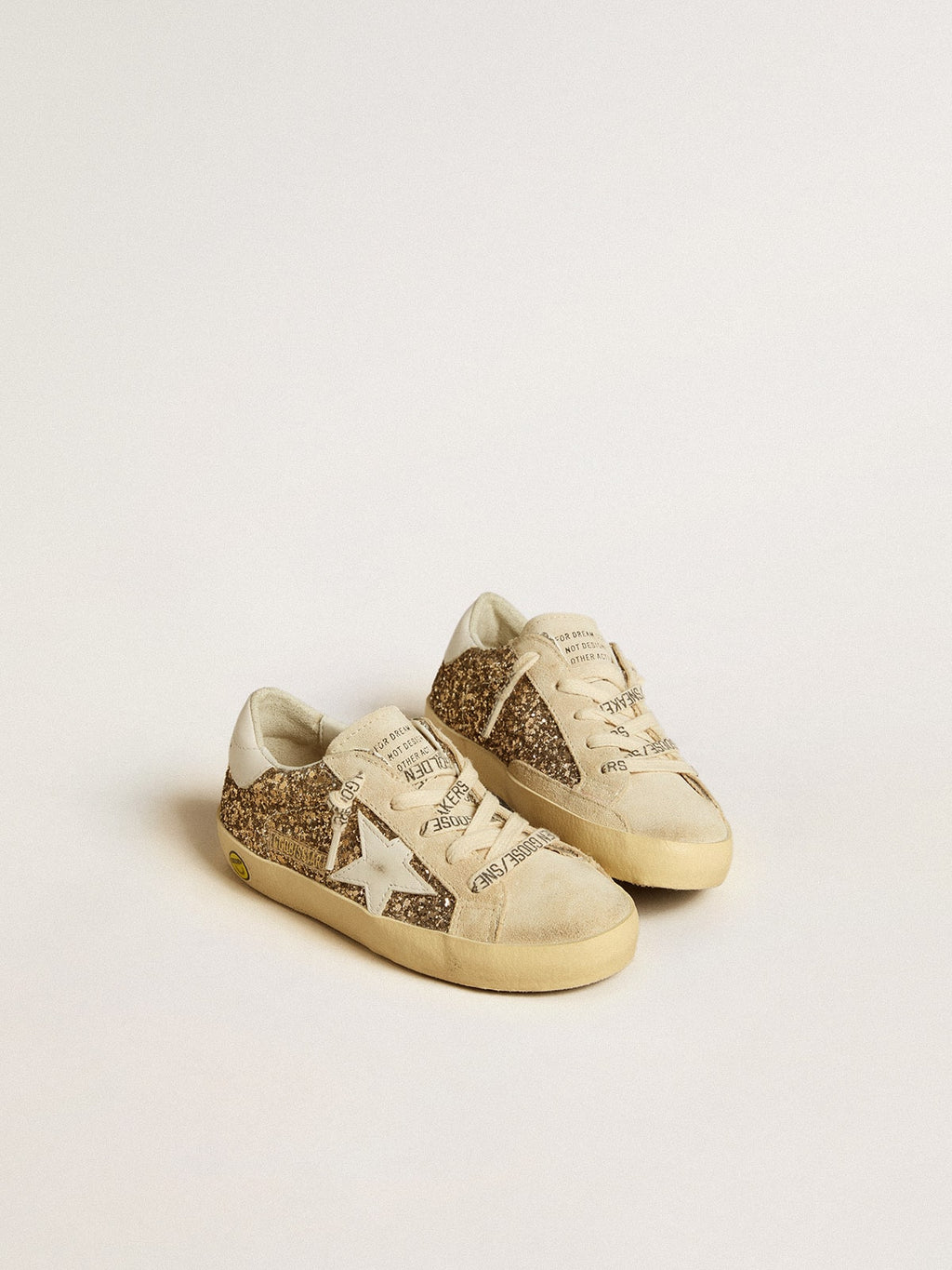 Super-Star Junior in gold glitter with white leather star and heel tab