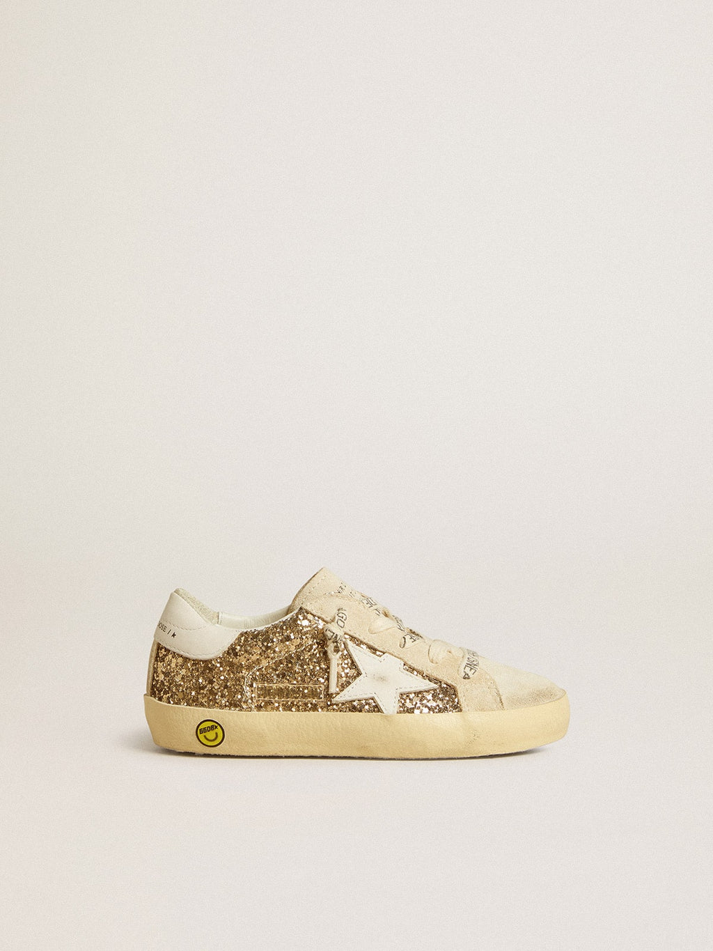 Super-Star Junior in gold glitter with white leather star and heel tab