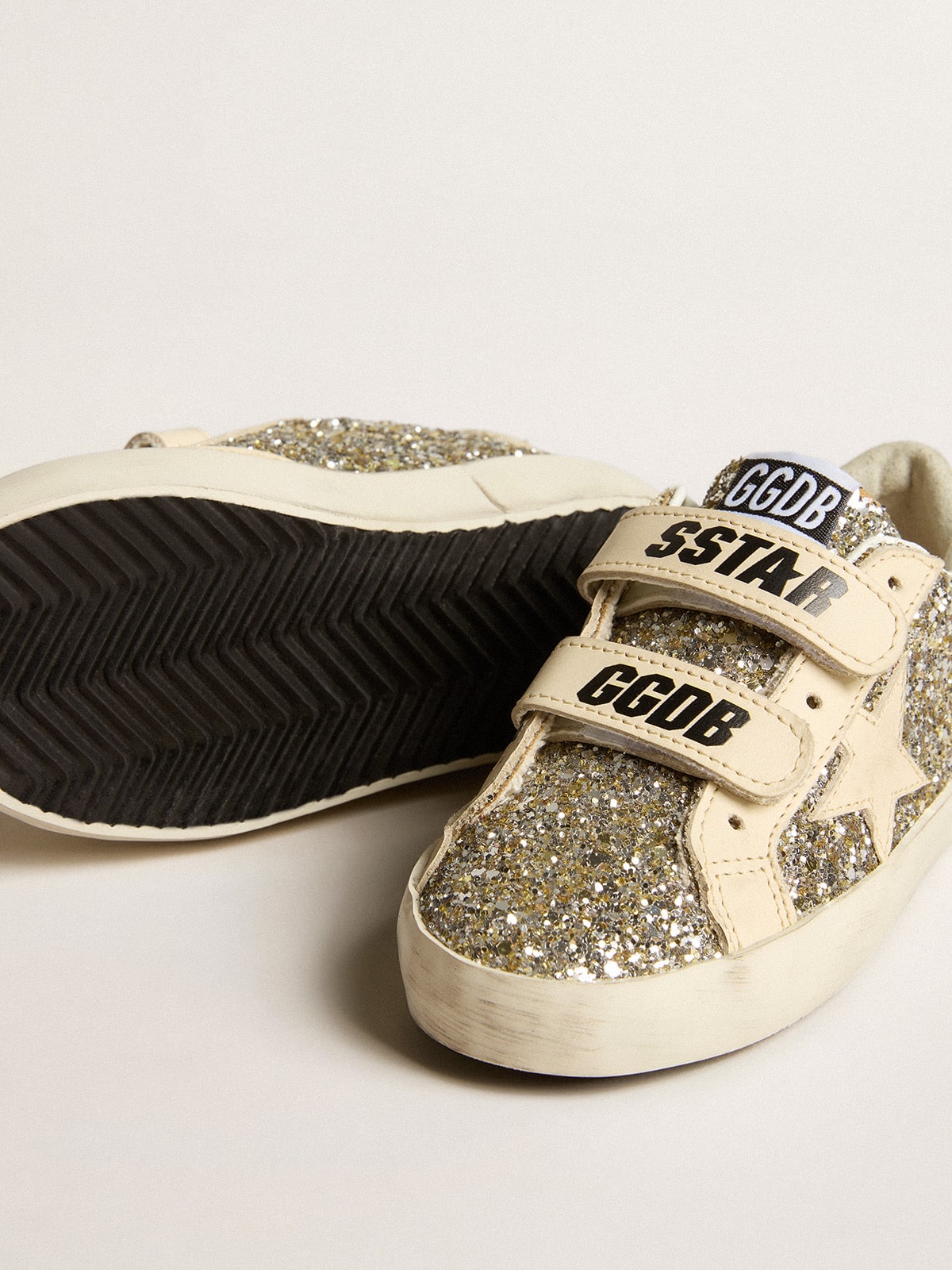Old School Junior in platinum glitter with leather star and heel tab