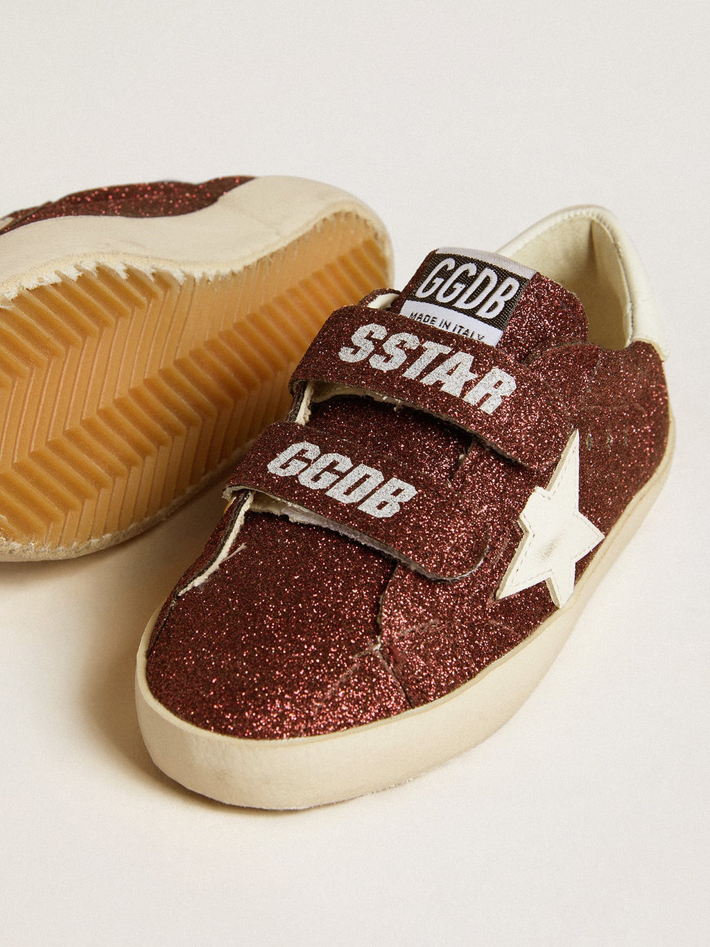 Old School Junior in burgundy glitter with leather star and heel tab