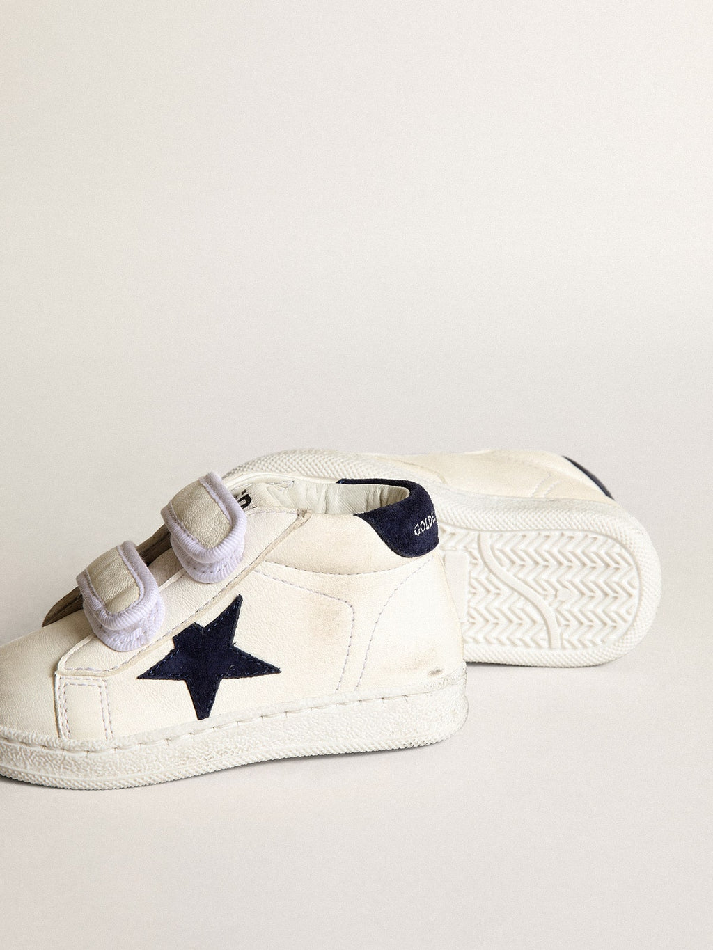 June Junior in nappa with dark blue suede star and heel tab