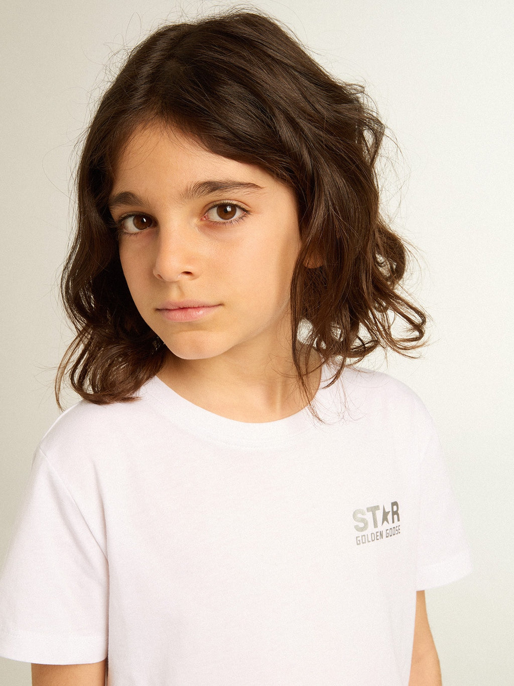White T-shirt with contrasting silver logo on the front