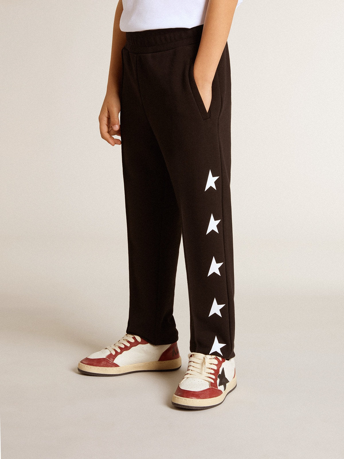 Boys’ black joggers with white stars