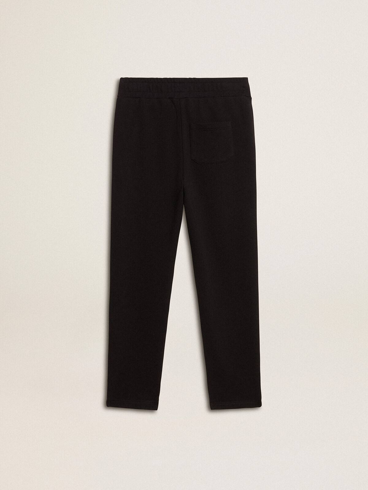 Boys’ black joggers with white stars