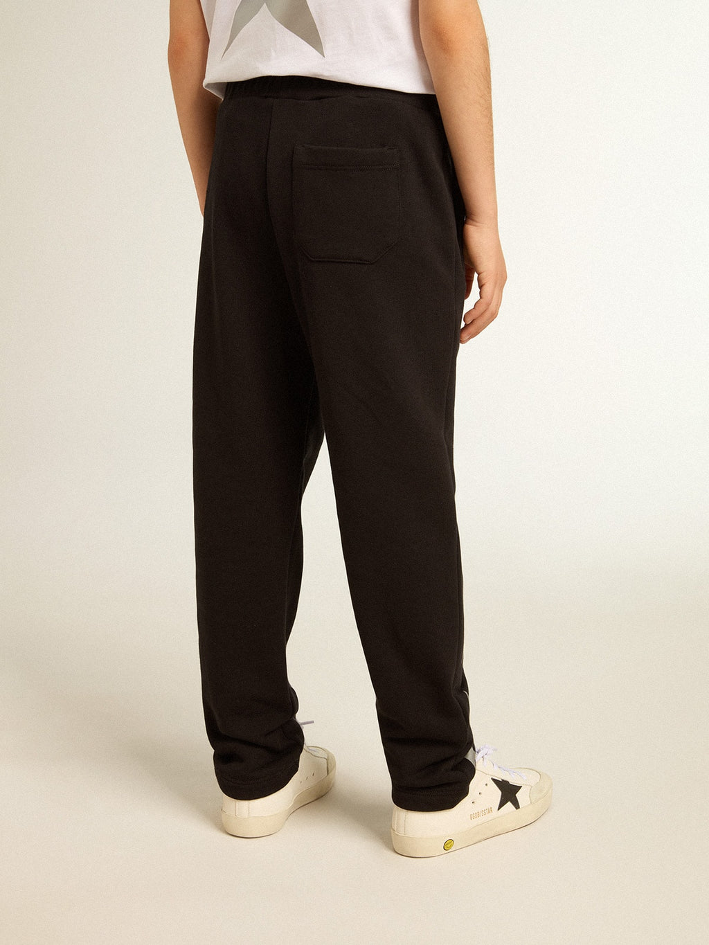 Boys’ black joggers with white stars
