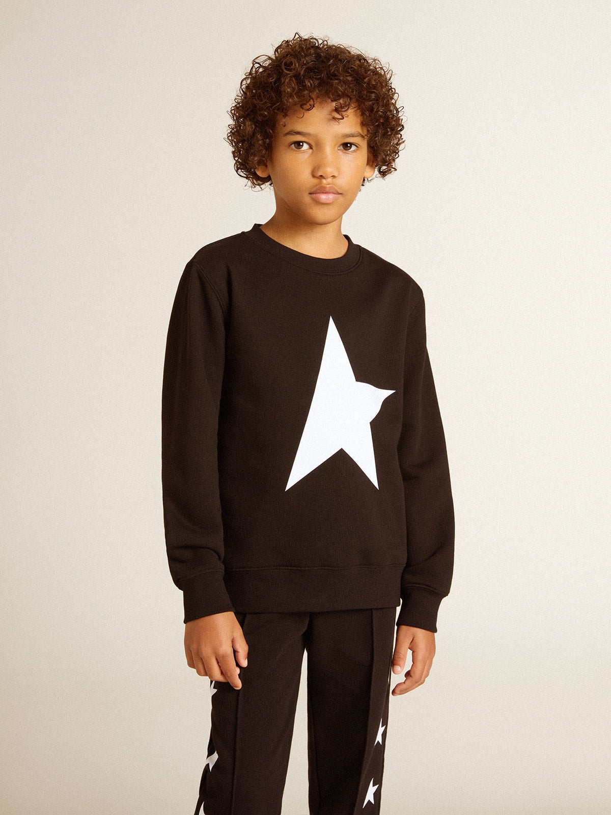 Boys’ black sweatshirt with white maxi star on the front