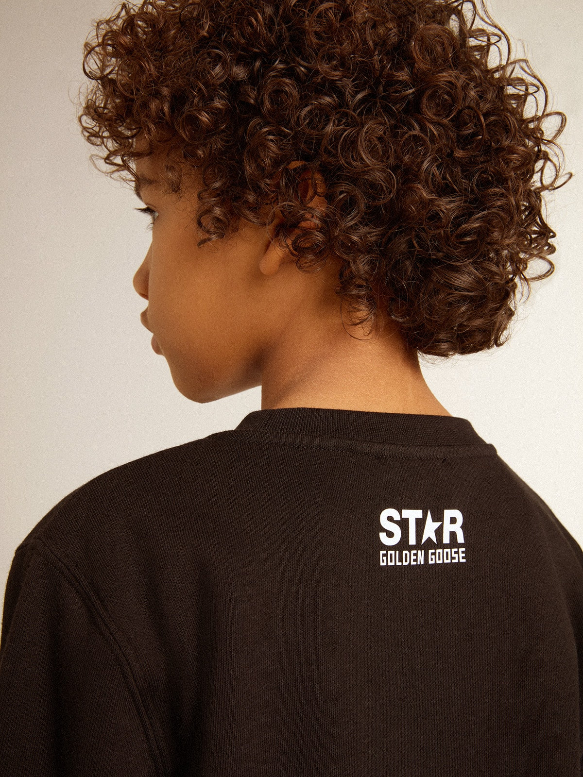 Boys’ black sweatshirt with white maxi star on the front