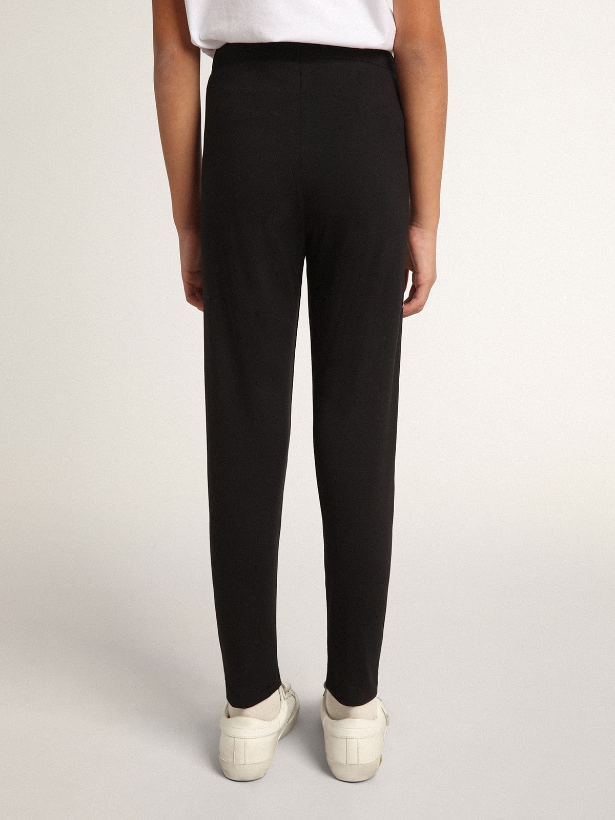 Girls’ black leggings with white stars on the sides