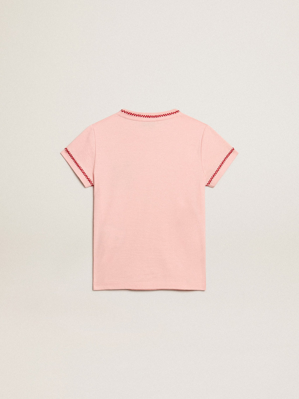 Pink T-shirt with red trim and embroidered flower on the heart