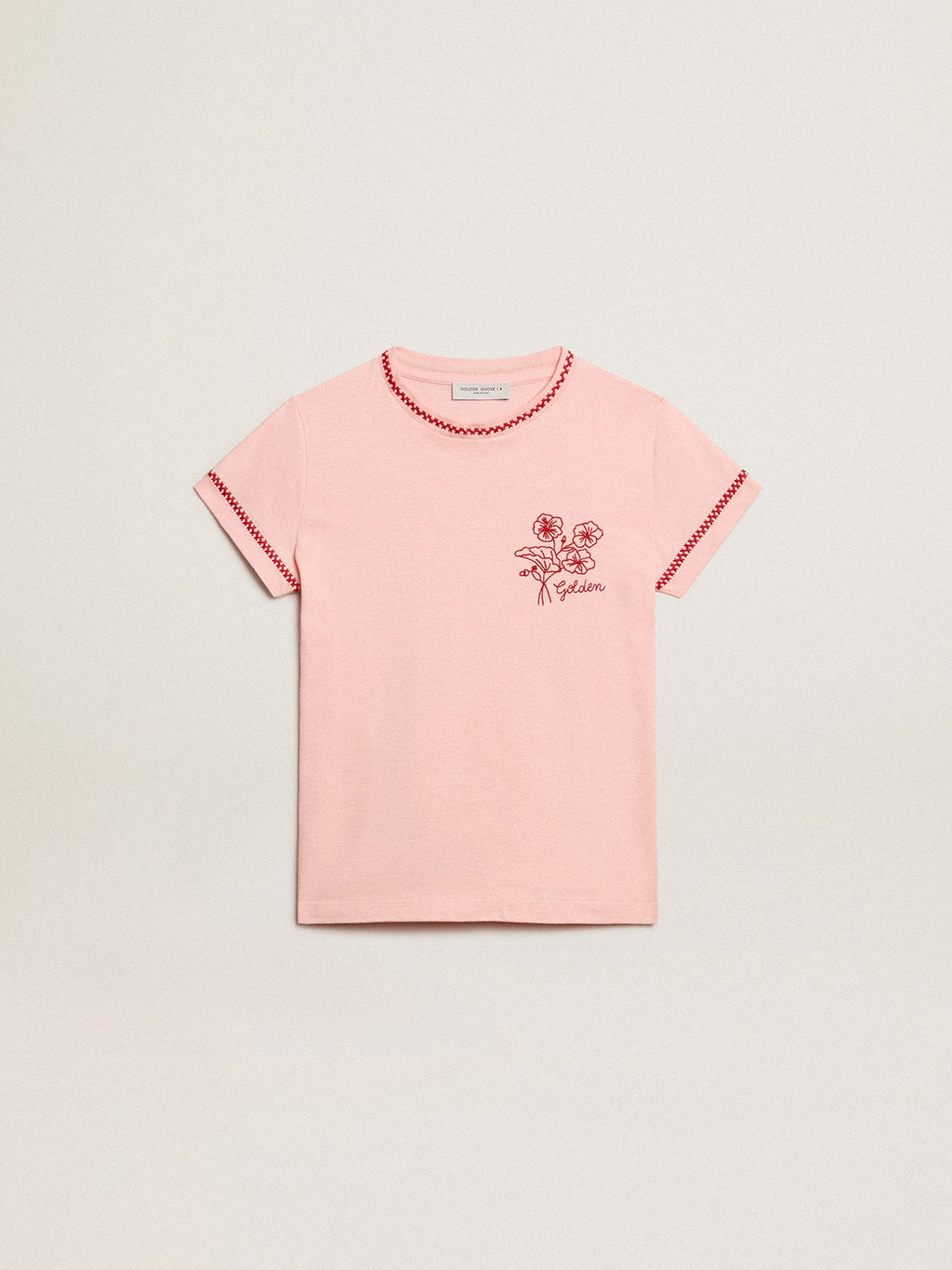Pink T-shirt with red trim and embroidered flower on the heart
