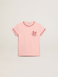 Pink T-shirt with red trim and embroidered flower on the heart