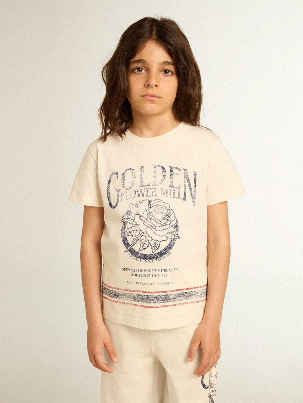 Cotton T-shirt in aged white with faded print at the center
