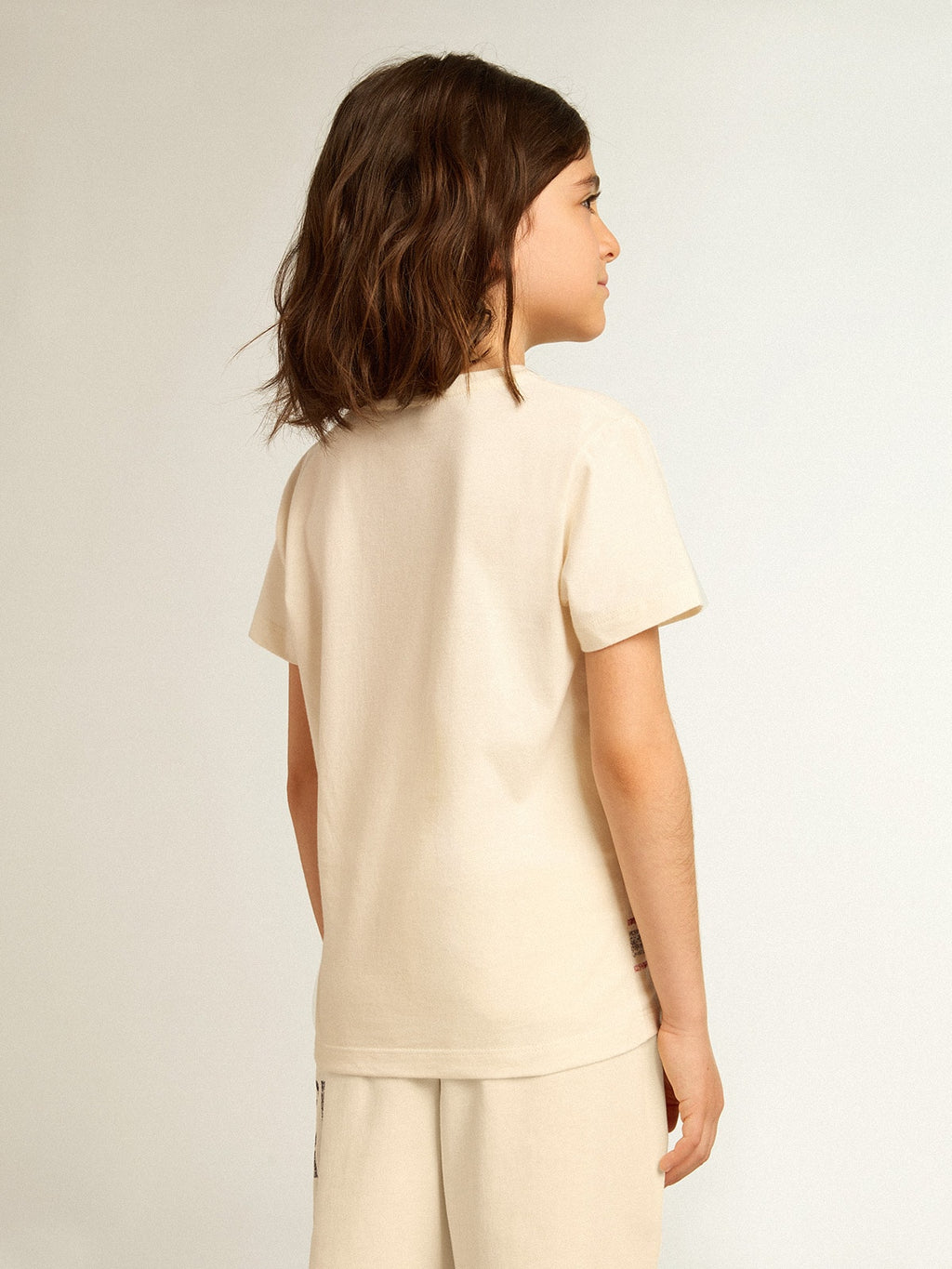 Cotton T-shirt in aged white with faded print at the center