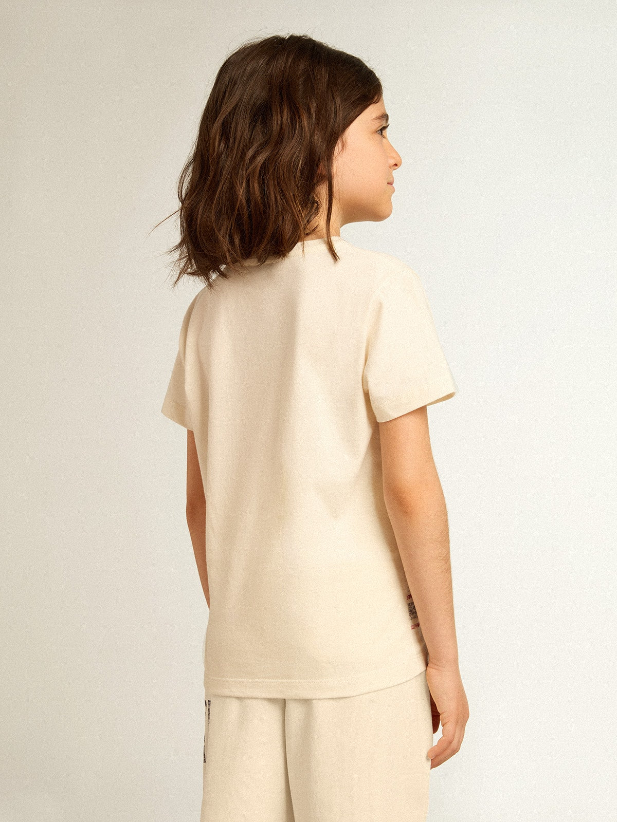 Cotton T-shirt in aged white with faded print at the center