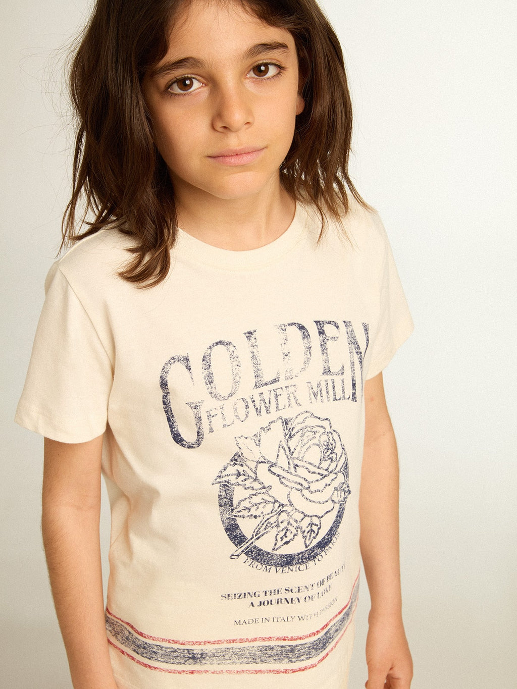 Cotton T-shirt in aged white with faded print at the center