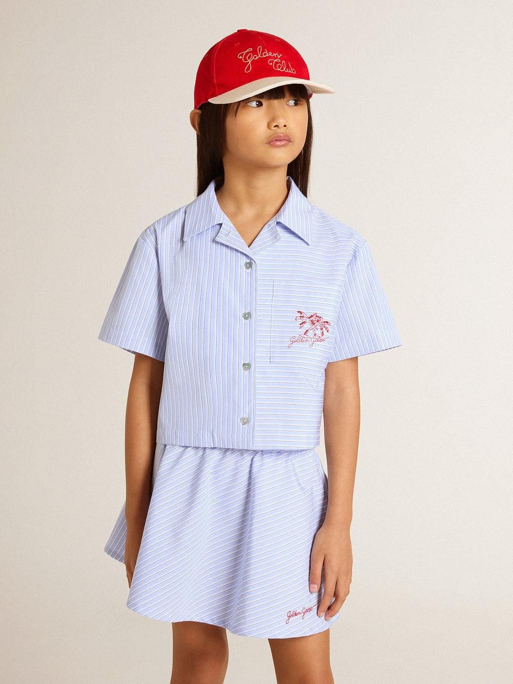Girls' cropped shirt in striped light blue cotton