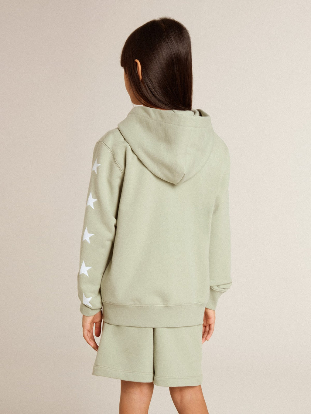 Light green sweatshirt with zip fastening