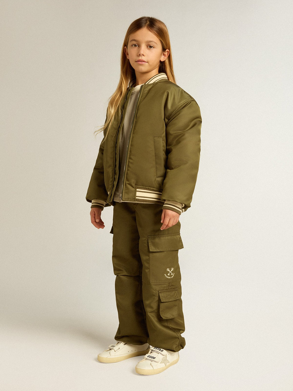 Kids military-green nylon bomber jacket with lettering on the back