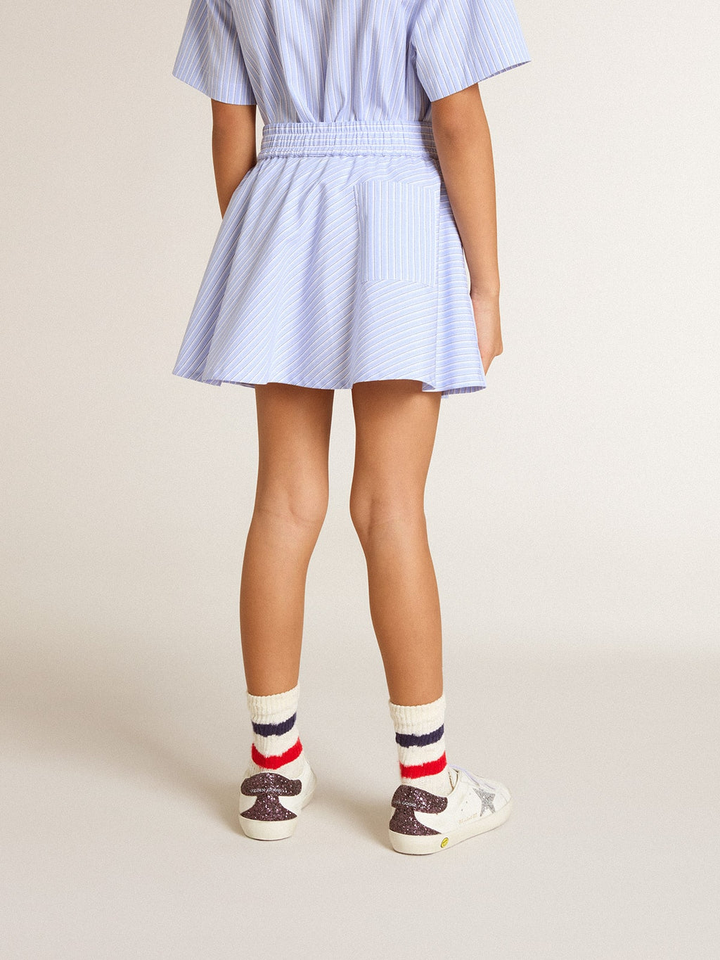 Girls' skirt with light blue stripes