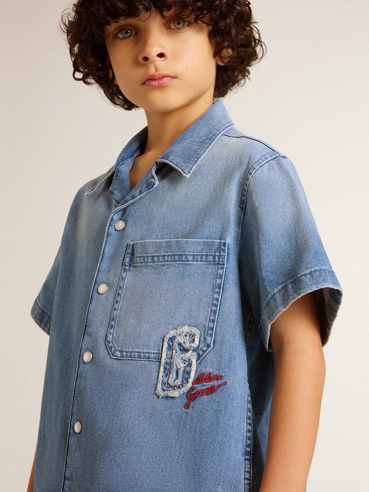 Kids’ denim shorts with embroidery on the back