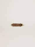 Men's lace accessory in old gold color in the shape of a skateboard