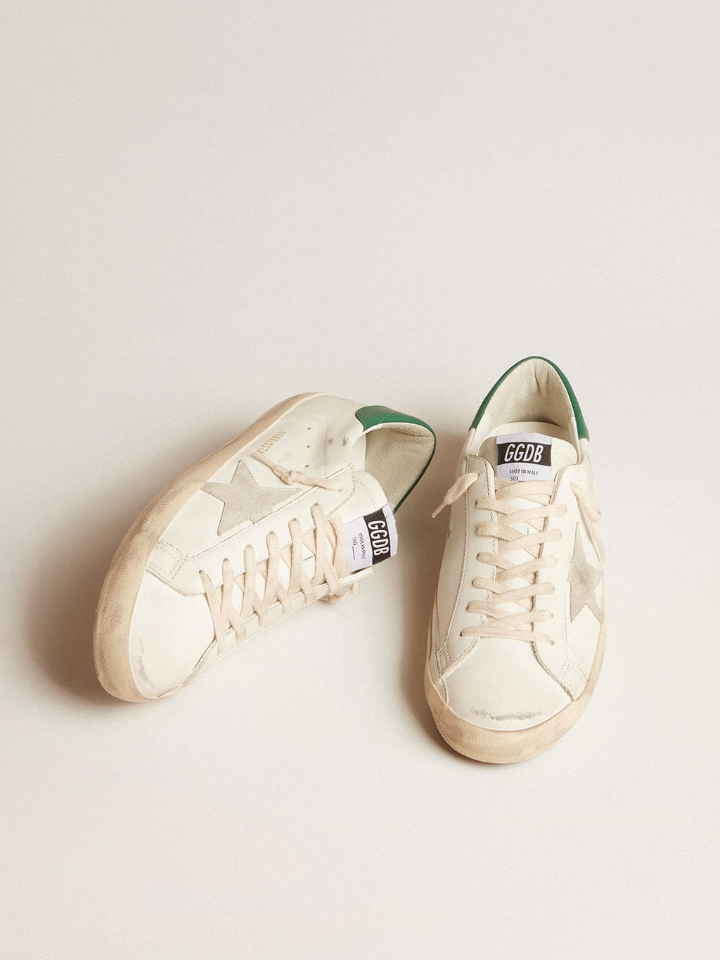 Super-Star in white leather with ice-gray suede star and green leather heel tab