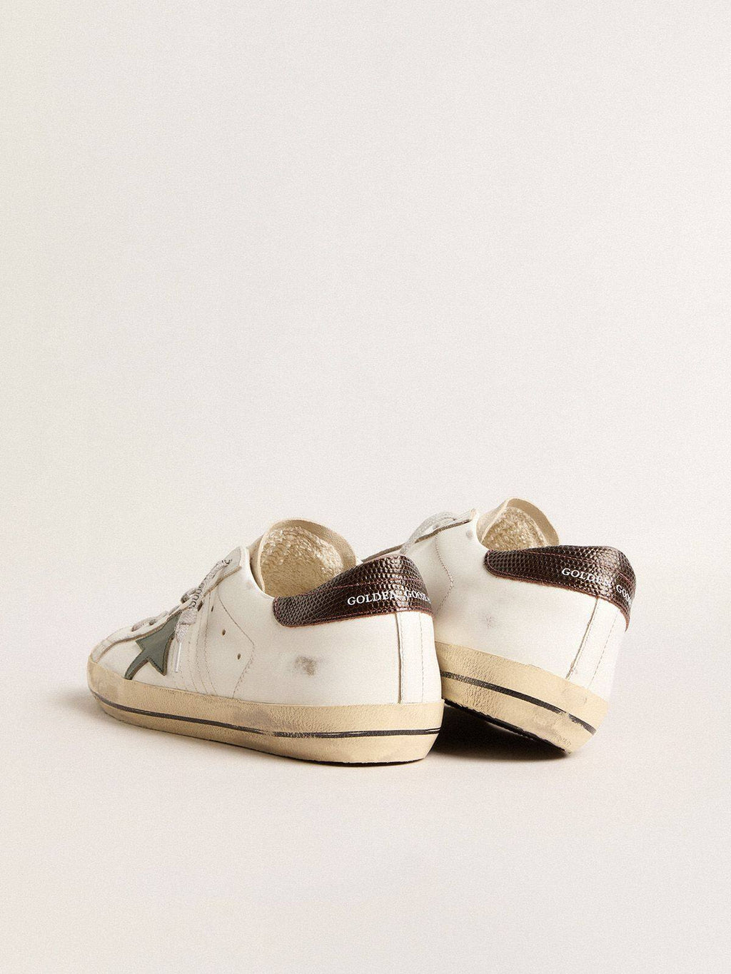 Men’s Super-Star in white leather with green star and animal-print heel tab