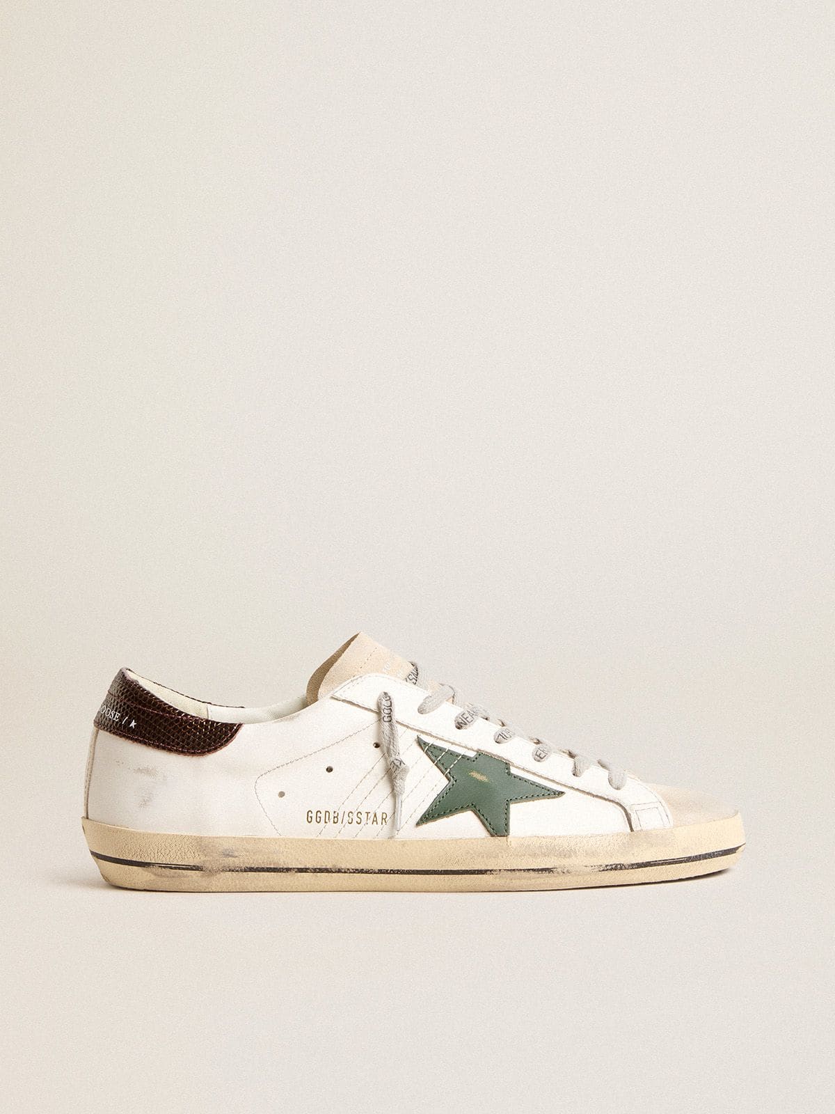 Men’s Super-Star in white leather with green star and animal-print heel tab