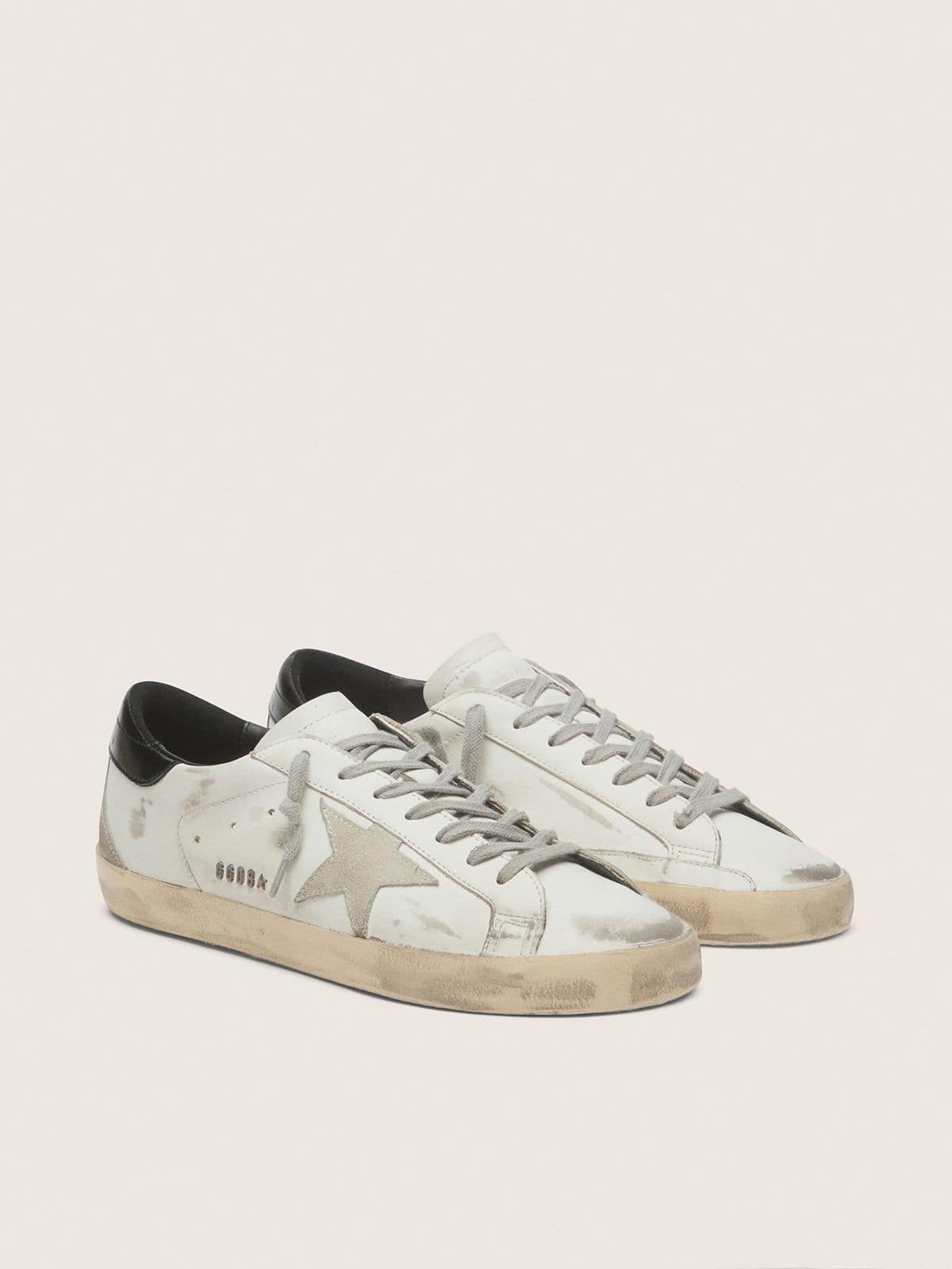 Men's Super-Star with black heel tab and metal stud lettering