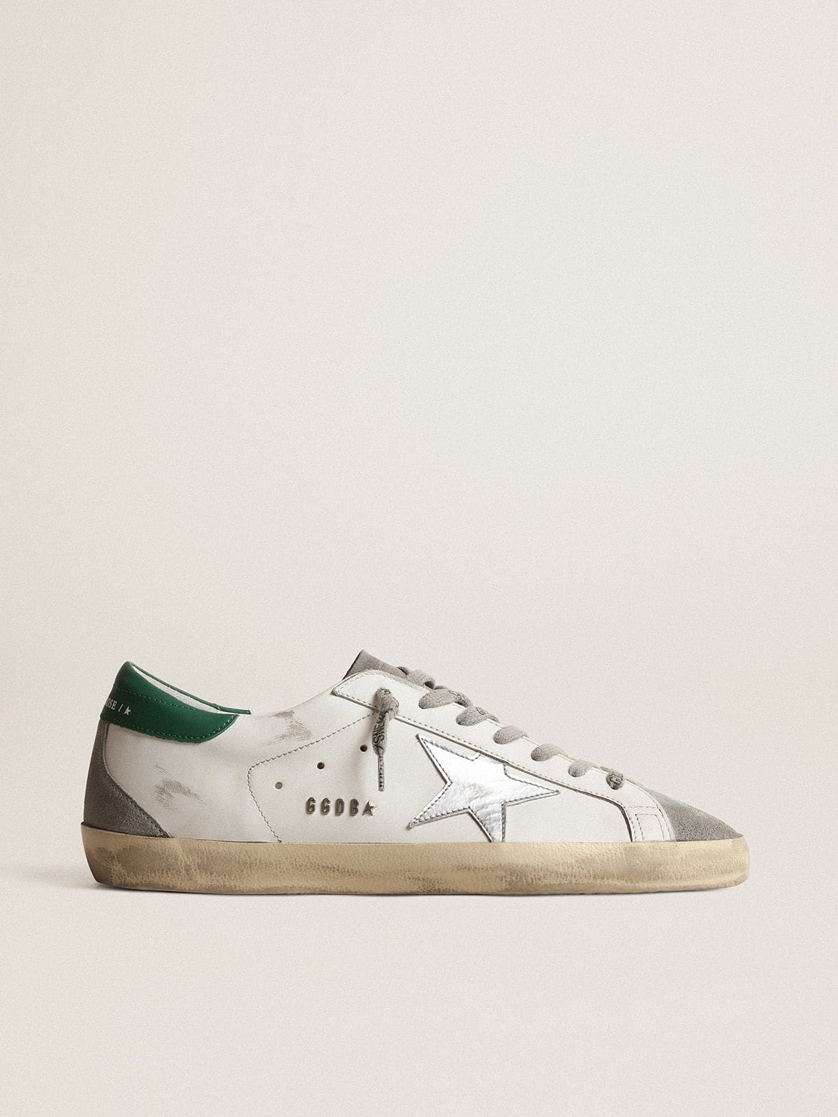 Men’s Super-Star in white leather with silver star and green heel tab
