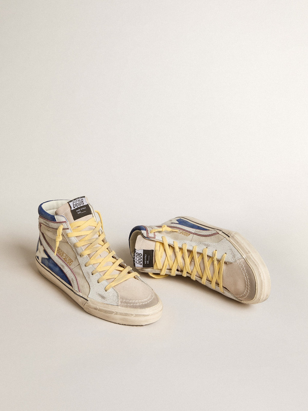 Slide in pearl canvas and blue suede with white leather star and flash
