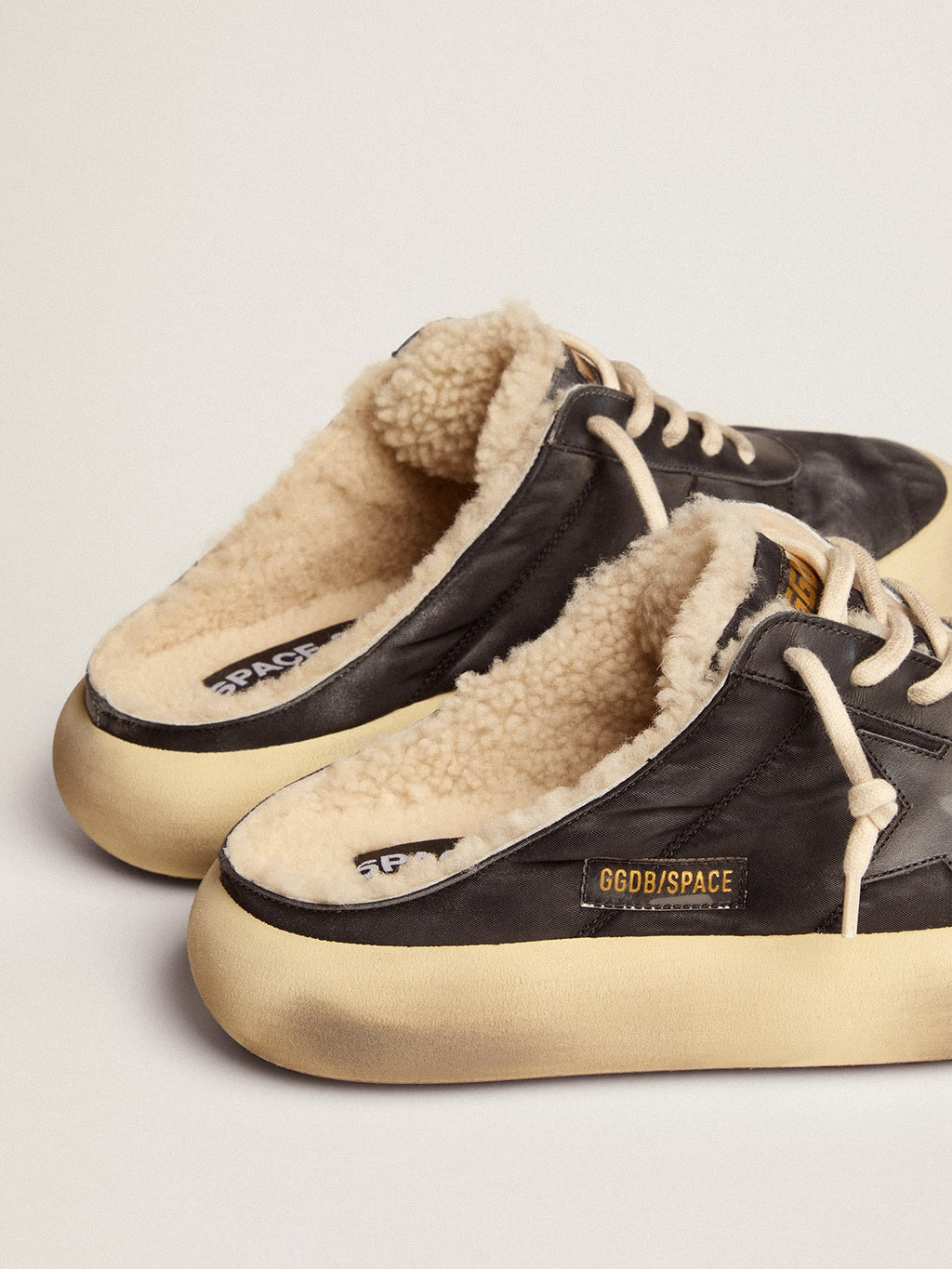Men's Space-Star Sabot shoes in quilted black nylon with shearling lining
