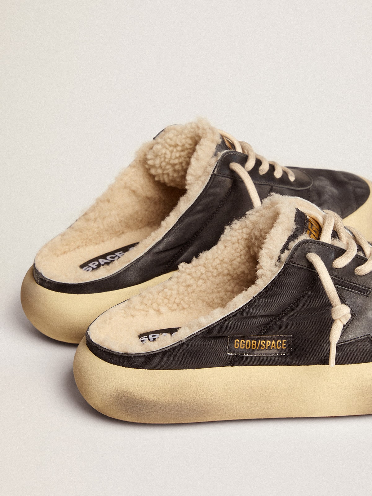 Men's Space-Star Sabot shoes in quilted black nylon with shearling lining