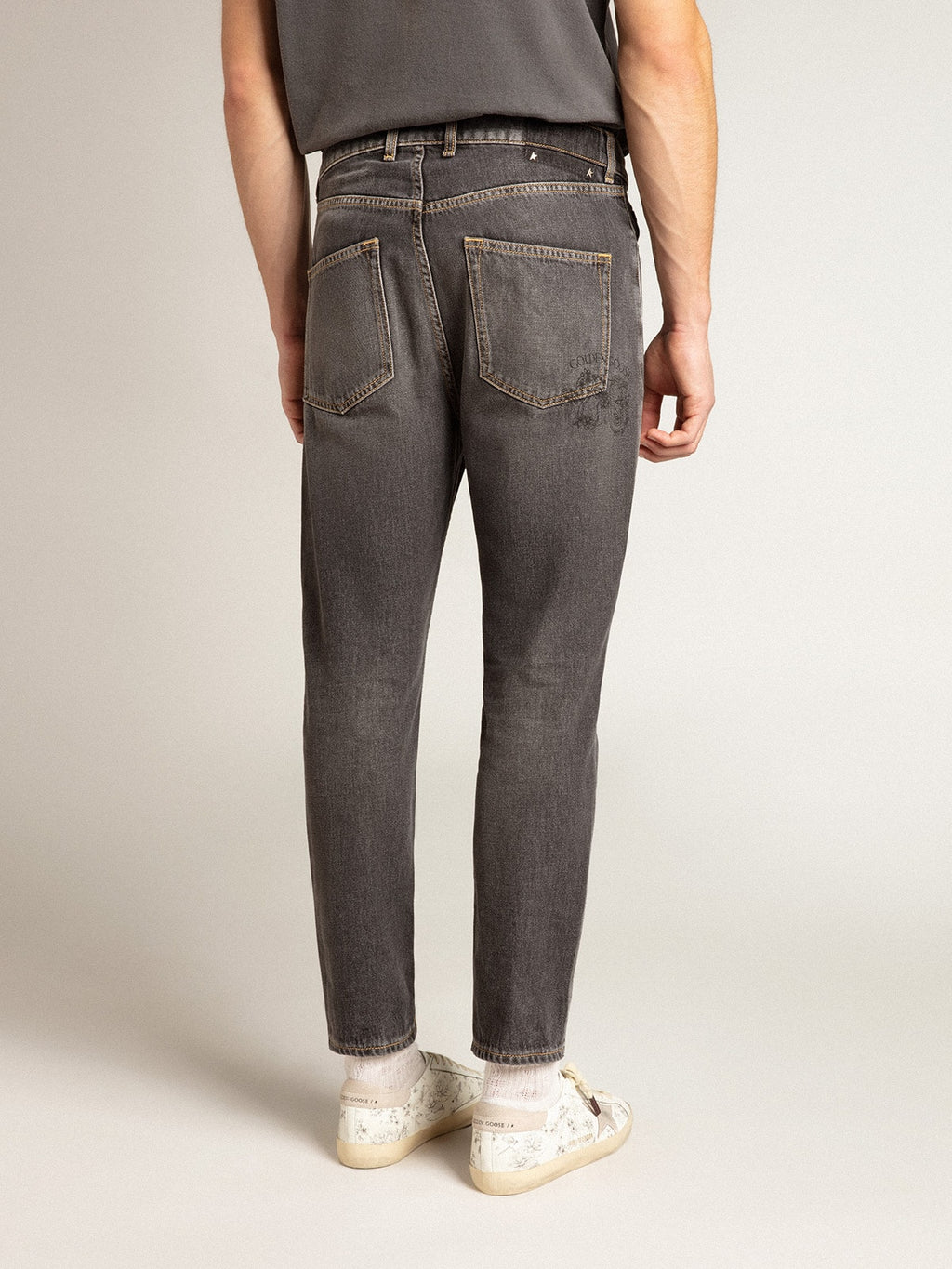 Men’s black jeans with printed pocket