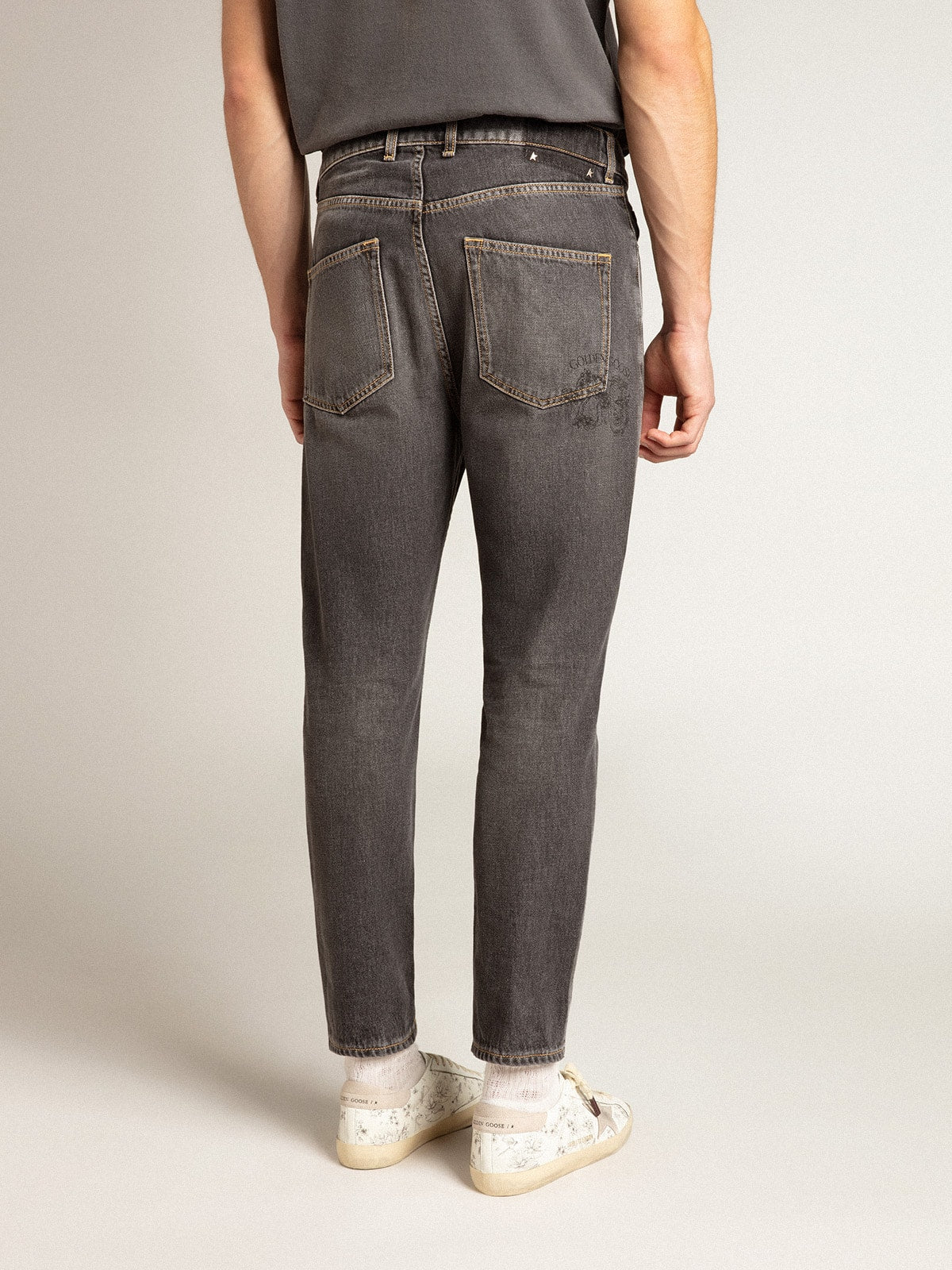 Men’s black jeans with printed pocket