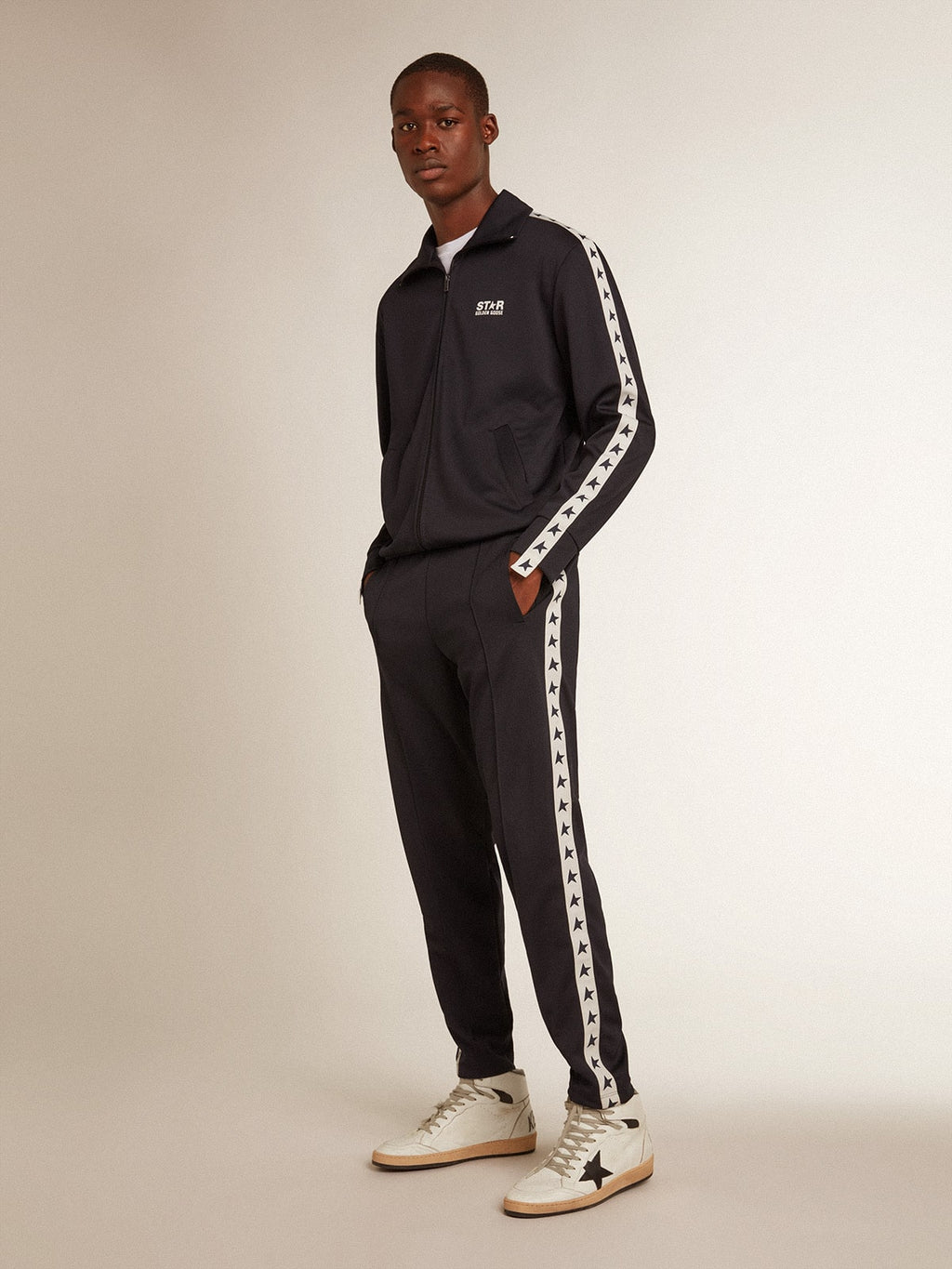 Dark blue sweatshirt with white strip and contrasting blue stars