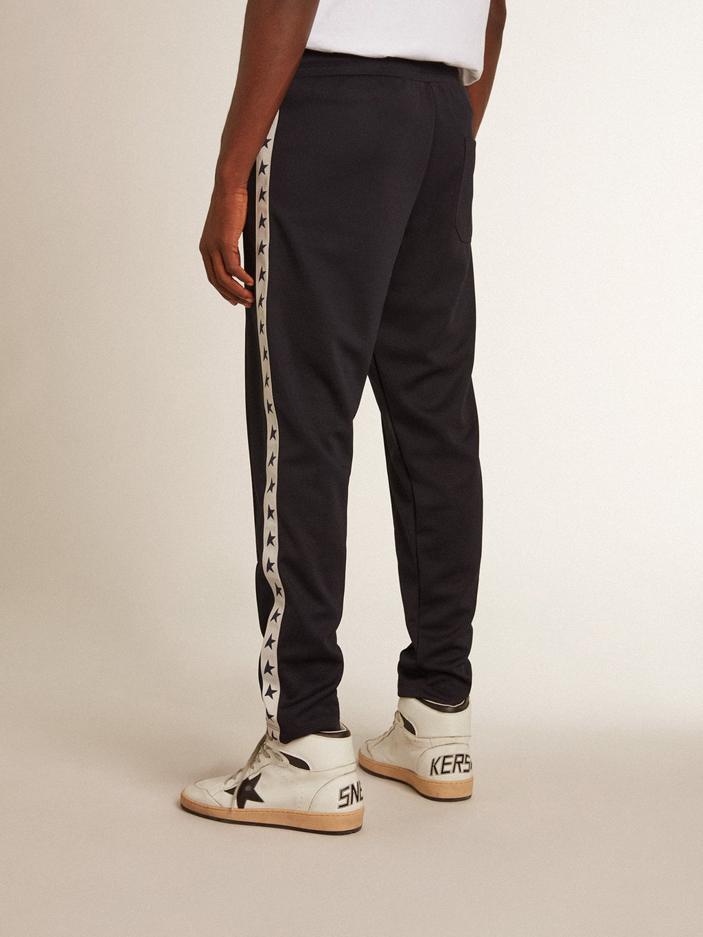 Dark blue joggers with contrasting strip and stars