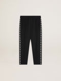 Men's black joggers with white stars on the sides