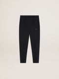 Men's black joggers with star on the front