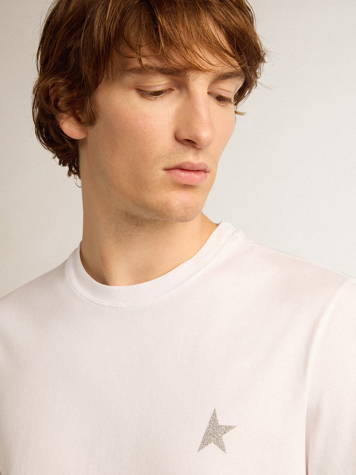 Men's white T-shirt with silver glitter star on the front