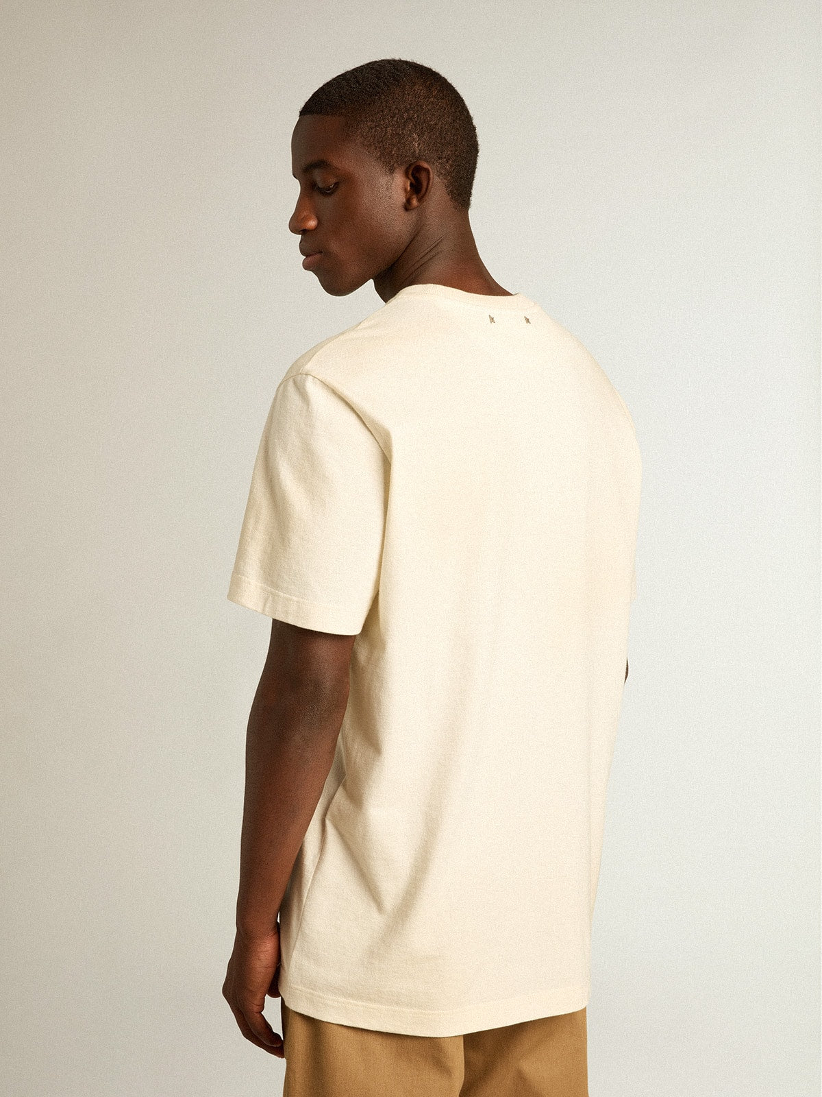 Men’s cotton T-shirt in aged white with faded lettering
