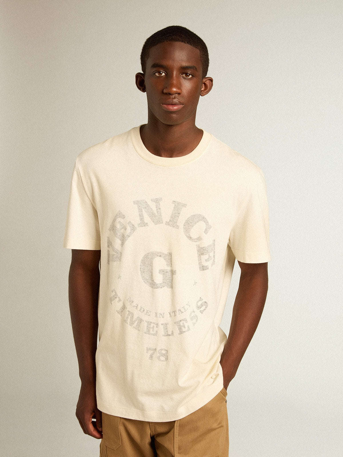 Men’s cotton T-shirt in aged white with faded lettering
