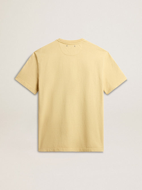 Men's cotton T-shirt in pale yellow with faded lettering