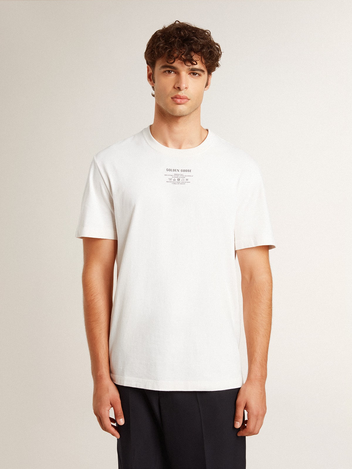 Men's worn-white cotton T-shirt with black lettering