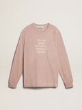 Powder-pink T-shirt with white lettering on the front