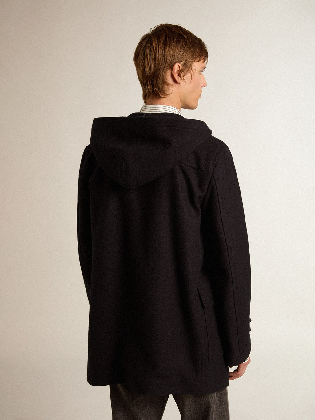 Dark blue wool duffle coat with hood and toggle fastening