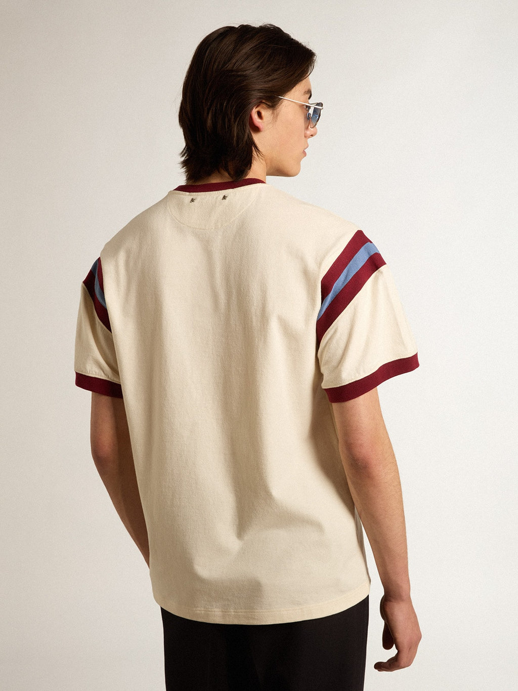 Men’s white T-shirt with burgundy lettering on the front