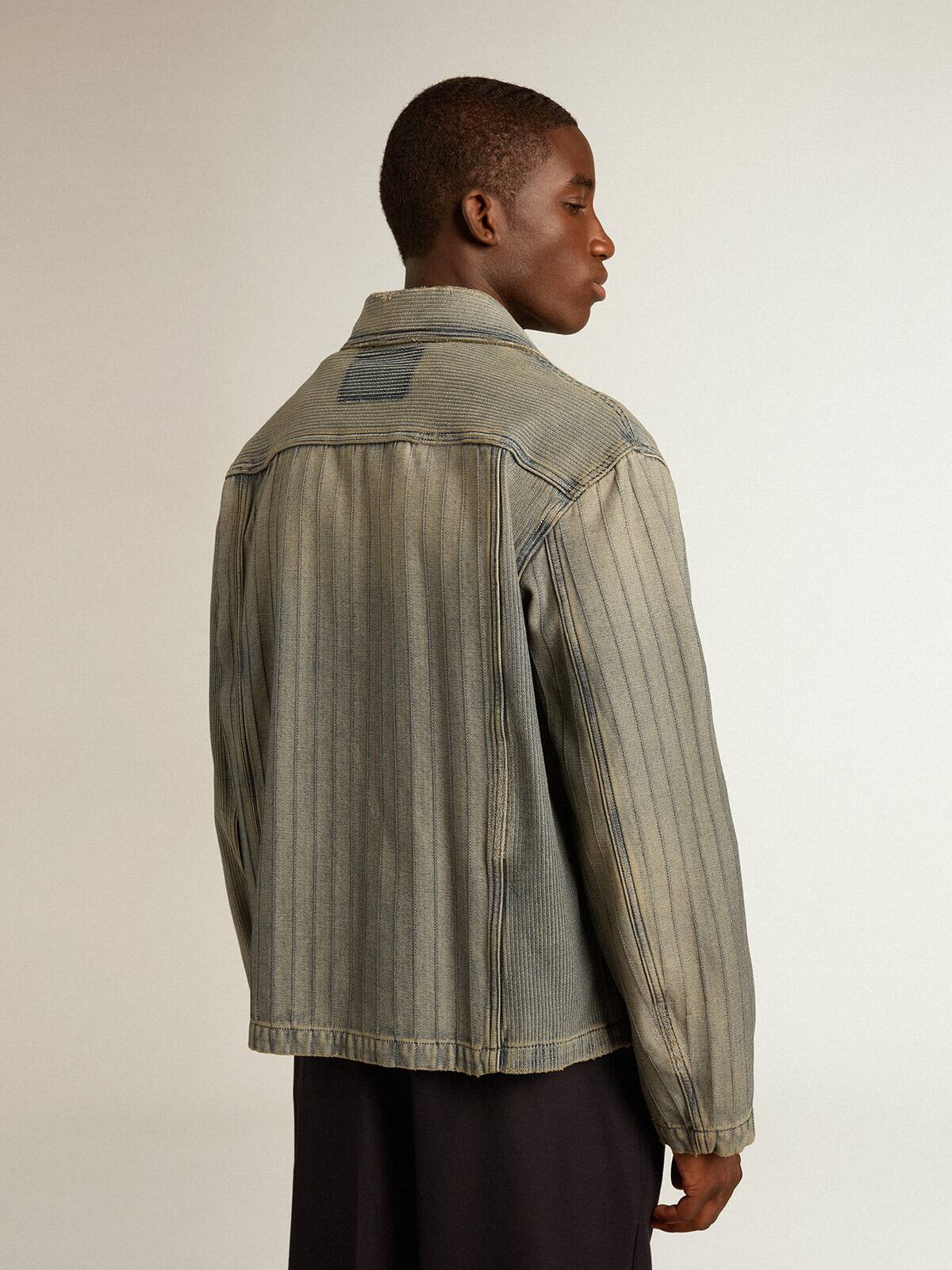 Men’s denim jacket with stripes and patches on the front