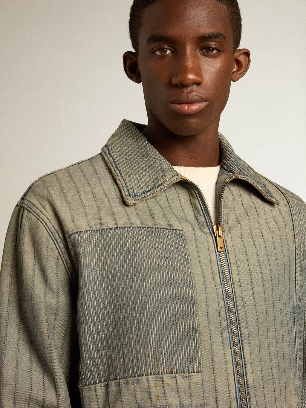 Men’s denim jacket with stripes and patches on the front